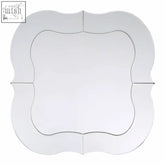 A sleek katelyn silver rounded wall mirror with a decorative scalloped frame and clean white edges