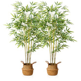 Two tall artificial bamboo plants with vibrant green leaves and yellow-green stalks in woven wicker baskets for indoor outdoor use