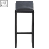 Kendari black leather teak wood bar chair with sleek modern design and sturdy metal frame for wood bar seating