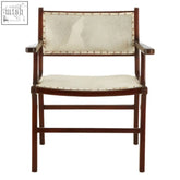 A sleek dark wood dining chair with cream leather seat and brass rivets made from teak wood for dining use