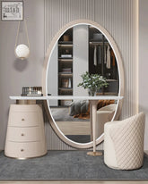 Oval-shaped mirror with sleek light beige frame and reflective surface for kendrick dressing table setup