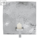 Silver hammered metal kensington townhouse large wall sconce holding a white candle for stylish wall decor