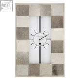 A kensington townhouse leather patchwork wall clock with a minimalist white face and neutral-toned leather patchwork frame