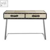 Cream-colored riveted trunk-style mango wood console table with black metal legs and handles for stylish storage