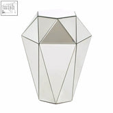 A sleek kensington townhouse silver side table with a geometric faceted mirror finish and silver-toned frame