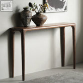 Dark brown kika table console with solid wood smooth surface and slender silhouette curved legs