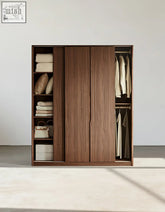 Modern wooden sliding door wardrobe in walnut with hanging rails perfect for stylish modern bedrooms