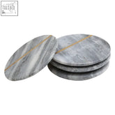 Set of four grey marble coasters with gold accent lines perfect for stylish drink protection and decor
