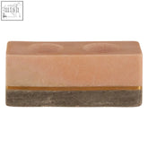 Kira tealight holder featuring a rectangular two-toned stone design with peach top and gray base for tealight use