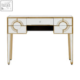 This knightsbridge console table is a white mirrored vanity desk with gold-trimmed circular drawer and leg accents