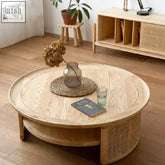 Round wooden kofuku coffee table with woven rattan lower shelf and natural wood grain finish