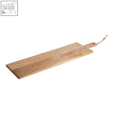 Light brown mango wood paddle serving board with natural grain finish and small handle tied with twine for chopping