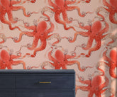 Kos octopus wallpaper featuring vibrant coral red octopus with detailed tentacles and gray outlines on soft pink background