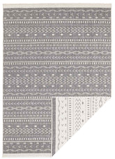 Gray and white geometric-patterned kuba reversible indoor-outdoor rug with a woven texture for versatile use