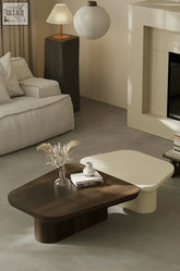 Modern minimalist kuro coffee table with dark wood top and white base perfect for living room decor and coffee table use
