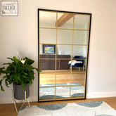Kyō full length floor mirror with black metal rectangle frame and gold lattice grid dividing reflective panels