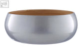 Small silver bamboo bowl with shiny metallic exterior and natural bamboo interior for stylish kitchen use