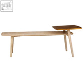 Minimalist kyra coffee table with warm gold finish featuring a wooden bench and dark brown square side table