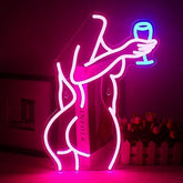 A glowing pink neon sign of a woman holding a blue champagne glass perfect for bedroom bar or party decor neon light