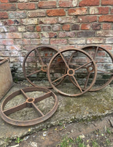 Rusty iron cambridge roller wheels with radial spokes and hubs set of 4 for antique salvage or shepherds hut use