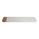 A large white marble serving board with subtle gray veins and a mango wood cork edge by monzaro