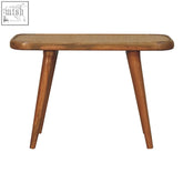 Larissa rattan bench with a woven cane top and solid mango wood tapered legs in mid-century modern style