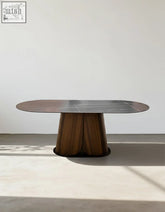 Modern lauren dining table with sleek black sintered stone top and dark fluted wood base for stylish dining spaces