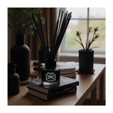 Black glass reed diffuser with dank mix lavender label and black reeds for lavender essential oil scenting