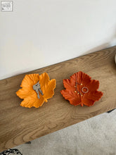 Vibrant orange and rust-colored ceramic leaf trinket dish with detailed vein patterns for small item storage