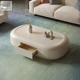 Cream-colored leah coffee table with glossy finish and built-in drawer perfect for stylish living spaces