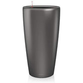 Dark gray lechuza rondo 32 self watering planter with drainage hole and red tipped watering device made of plastic