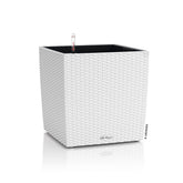 White lechuza self watering plant pot cube with woven rattan look plastic and water level indicator for indoor outdoor use