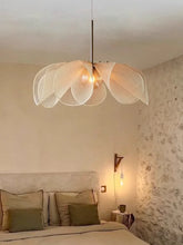 A delicate off-white led flower pendant light with petal-shaped shade hanging from a slender metallic rod ideal for living room