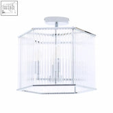 Clear glass chandelier with hexagonal chrome frame and vertical crystal rods in lerici 4 light chrome pendant light