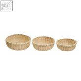 Set of three natural woven wicker baskets made from sustainably sourced bamboo in varying sizes for versatile storage