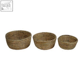 Set of three natural straw lidi set baskets in beige with black detail and handcrafted woven patterns