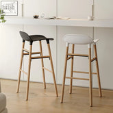 Modern lila sketchy bar stool with sleek black and white plastic seats on light wood legs for stylish seating