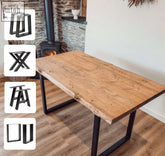 Rustic wooden waney edge dining table with black metal legs perfect for a stylish edge dining table setup