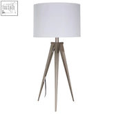 A sleek livia table lamp with a white cylindrical shade and brushed metal tripod base perfect for modern decor