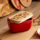 Red ceramic butter dish with a light wood lid engraved with lobster illustrations perfect as a red butter dish