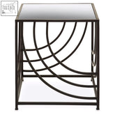 Logan side table features a black iron frame with curved geometric design and a mirrored glass top that reflects light