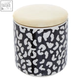 Black ceramic london leo medium canister with white leopard print and cream-colored lid for stylish kitchen storage