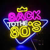 A vibrant pink and yellow neon light sign with a blue frame and crown saying back to the 80s perfect for party decor