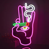 A vibrant pink hand peace gesture eye neon sign with green red and white led lights for wall decor and home bars