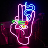 A glowing neon sign shaped like a pink hand with an eye and colorful lights perfect for game room or wall decor neon signs
