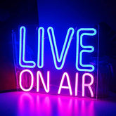 A glowing led neon sign with bright cyan live and vivid pink on air letters perfect air neon sign for studio or party