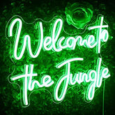 A glowing green led jungle neon sign reading welcome to the jungle perfect for bedroom wall decor or home bar