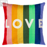 Rainbow-striped love needlepoint cushion with bold white love lettering perfect for cozy home decor