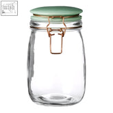 Clear glass jar with retro pastel green lid and rose gold clasp perfect for stylish kitchen storage