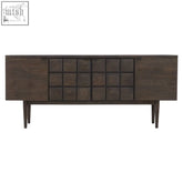 Dark oak sideboard with a grid of square panels and slender legs made from recycled oak wood